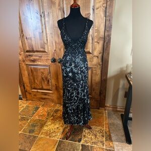 Cassandra Stone by Mac Duggal gown. Black sequins. Plunging neck line.